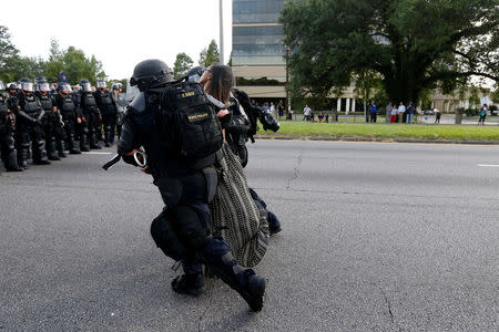 Protestor Ieshia Evans is detained by law enforcement near the headquarters of the Baton Rouge Police Department in Baton Rouge, Louisiana, U.S. July 9, 2016. REUTERS/Jonathan Bachman