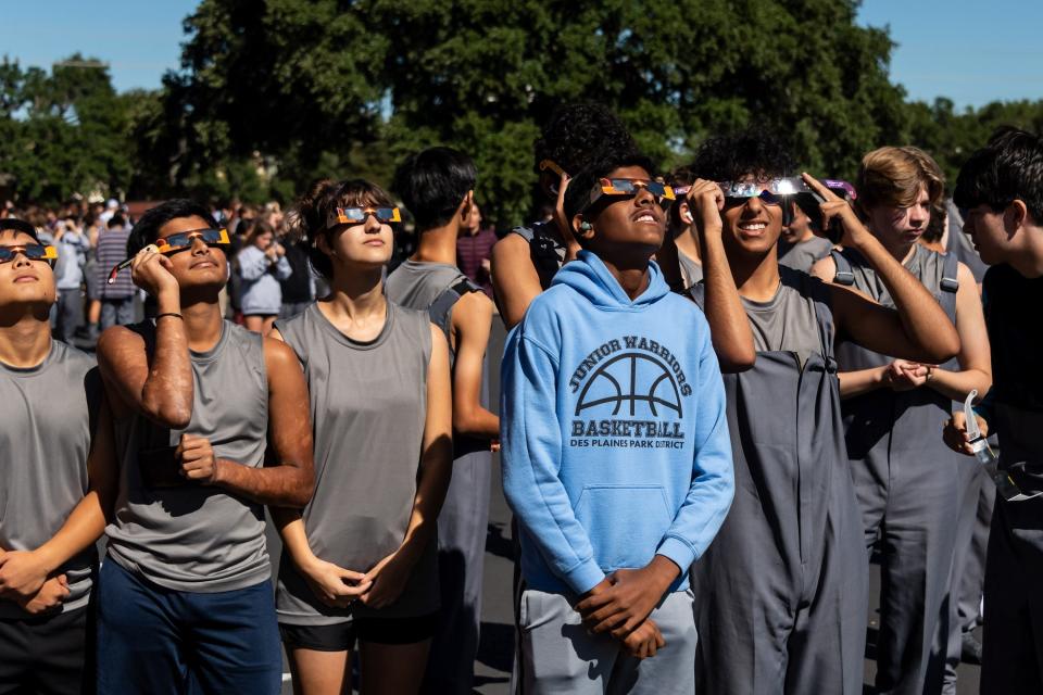 Members of the Westlake High Band safely viewing the eclipse. The Cedar Ridge High School Band hosted the Texas Marching Classic at Kelly Reeves Stadium in Round Rock on October 14, 2023. There was a lunch/solar eclipse break for the annular solar eclipse just before noon.