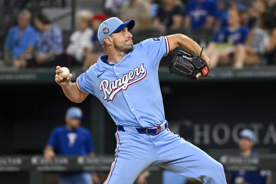 Texas Rangers starting pitcher Max Scherzer throws in his first baseball game back from the injury list in the first inning against the Kansas City Royals, Sunday, June 23, 2024, in Arlington, Texas. (AP Photo/Albert Pena)