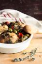 <p>The fragrance of Rosemary-Garlic Chicken spiked with zesty green olives will entice hungry guests into your kitchen. This dish yields a savory broth; serve it along with a loaf of crusty bread for dipping.</p><p><strong><a href="https://www.countryliving.com/food-drinks/recipes/a1619/rosemary-garlic-chicken-3733/https://www.countryliving.com/food-drinks/recipes/a1619/rosemary-garlic-chicken-3733/" rel="nofollow noopener" target="_blank" data-ylk="slk:Get the recipe;elm:context_link;itc:0;sec:content-canvas" class="link ">Get the recipe</a>.</strong></p>