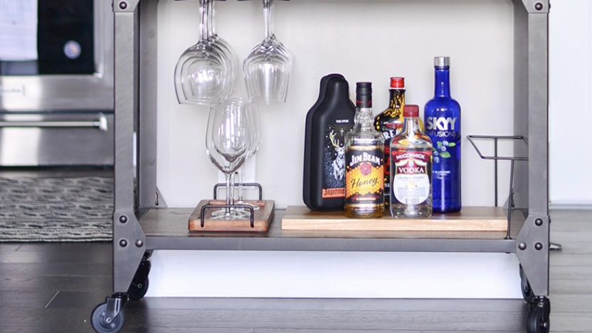 studio apartment ideas, bar cart by the kitchen with drinks and glasses