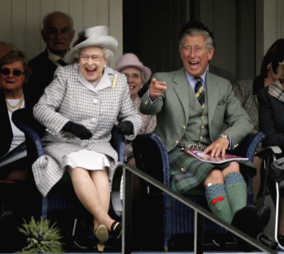 BRAEMAR, UNITED KINGDOM - SEPTEMBER 02: Queen Elizabeth II and  Prince Charles, The Prince of Wales laugh as they watch competitors during the Braemar Gathering at the Princess Royal and Duke of Fife Memorial Park on September 2, 2006 in Braemar, Scotland. Large crowds attend each year to acclaim their monarch and Chieftain of the Braemar Gathering. There have been gatherings of one sort or another at Bremar for the last nine hundred years.  (Photo by Chris Jackson/Getty Images)