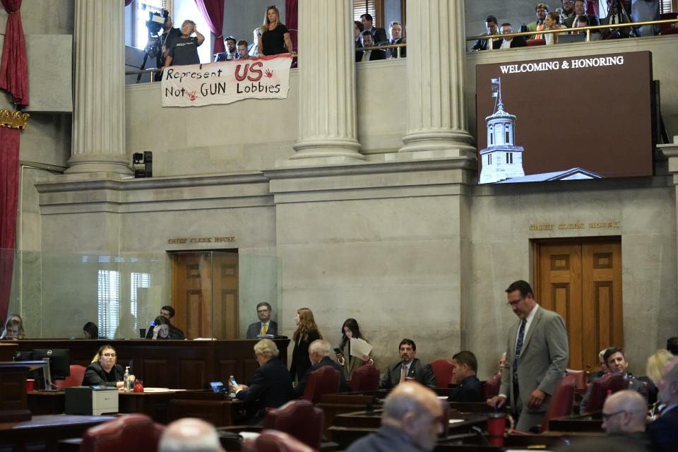 Demonstrators display a banner over the House chamber advocating for gun law reform during a special session of the state legislature on public safety, Monday, Aug. 28, 2023, in Nashville, Tenn. (AP Photo/George Walker IV)