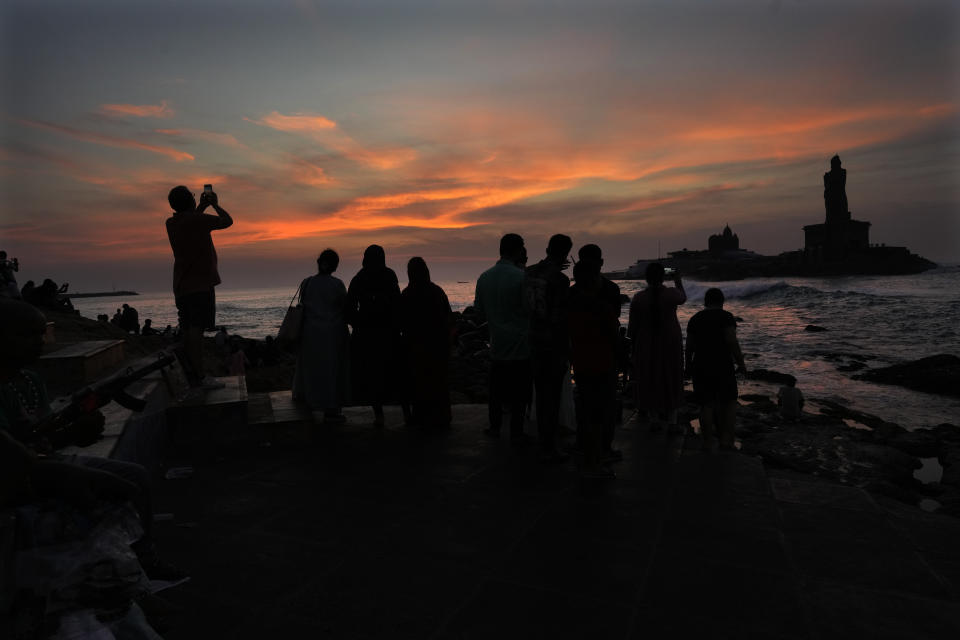 Tourists wait to watch the sun rise at Kanyakumari, India, Monday, April 22, 2024. (AP Photo/Manish Swarup)
