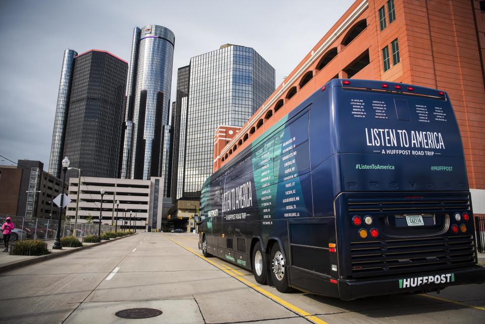 The HuffPost tour bus sits in front of the Renaissance Center, which is owned by General Motors, in Detroit on Oct. 4, 2017.