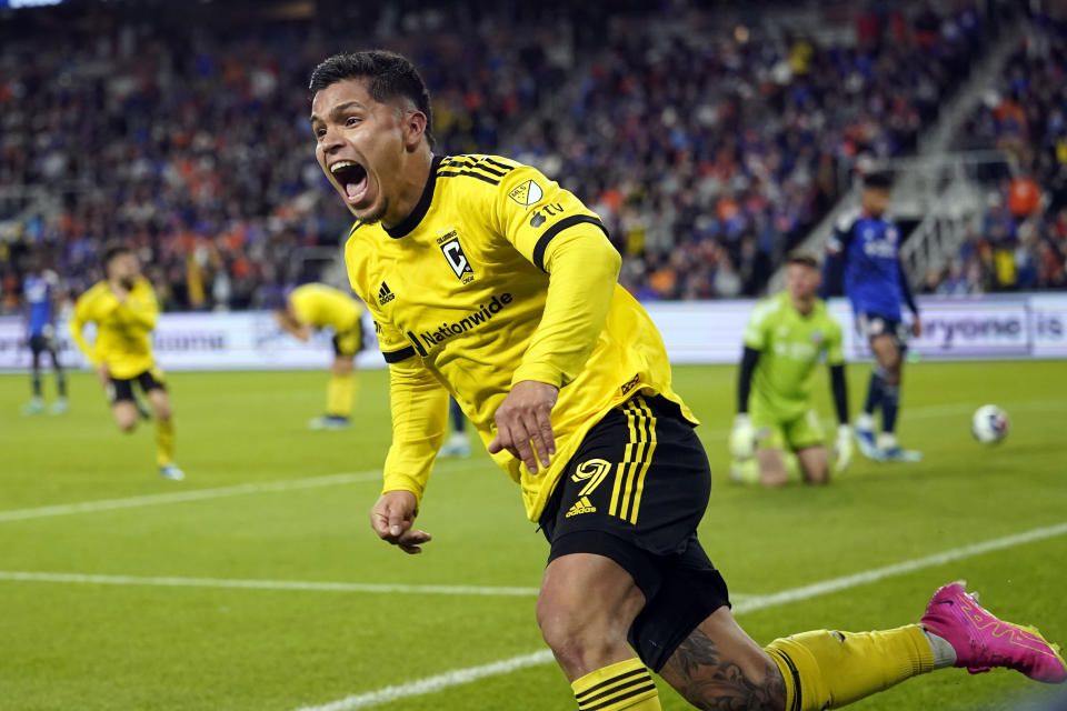 Columbus Crew forward Cucho Hernández (9) celebrates after teammate Christian Ramirez (17) scored during the second half of overtime in the MLS Eastern Conference final soccer match against FC Cincinnati, Saturday, Dec. 2, 2023, in Cincinnati. the Crew won 3-2 in extra time. (AP Photo/Carolyn Kaster)