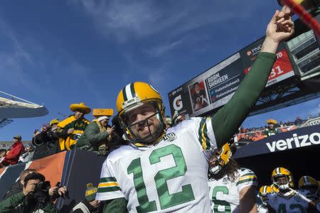 FILE PHOTO: Dec 16, 2018; Chicago, IL, USA; Green Bay Packers quarterback Aaron Rodgers (12) greets a fan while taking to the field before their game against the Chicago Bears at Soldier Field. Mandatory Credit: Mark Hoffman/Milwaukee Journal Sentinel via USA TODAY NETWORK