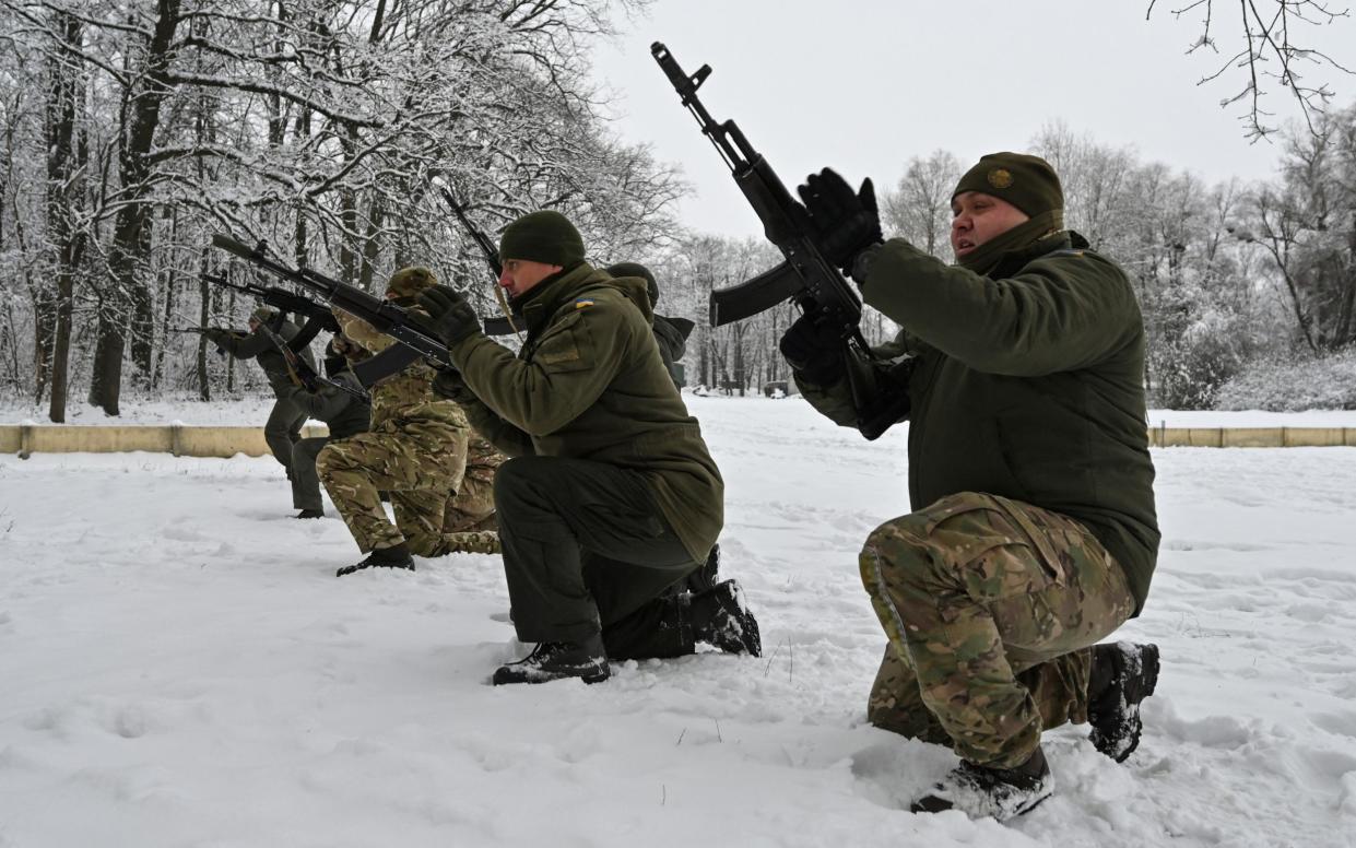 Ukrainian national guard members train in the northern region of Kharkiv