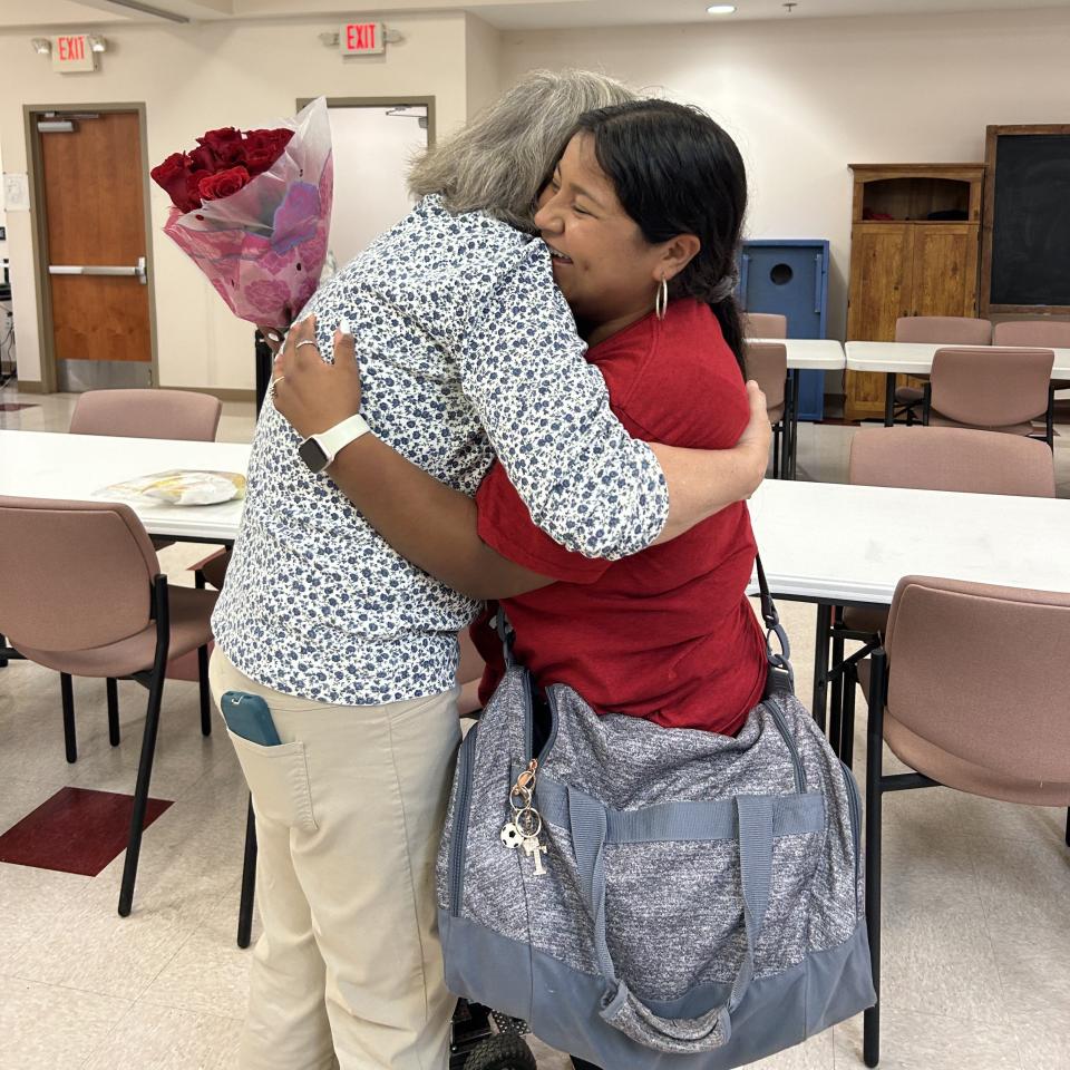 Davie County High School senior Tania Arellano hugs Anne, her pen pal. The pen pal program was organized by English teacher Ashley Snider.
