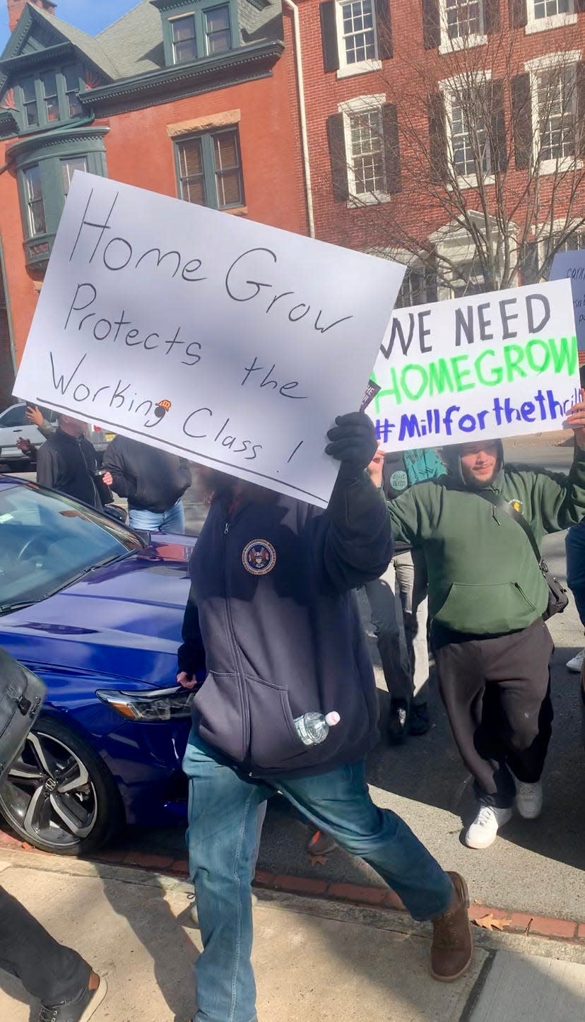 Cannabis activists march to the New Jersey Statehouse on Feb. 22, 2204, to commemorate three years since the state legalized marijuana for recreational purposes and to call for a new law allowing medical marijuana patients to grow cannabis at home.