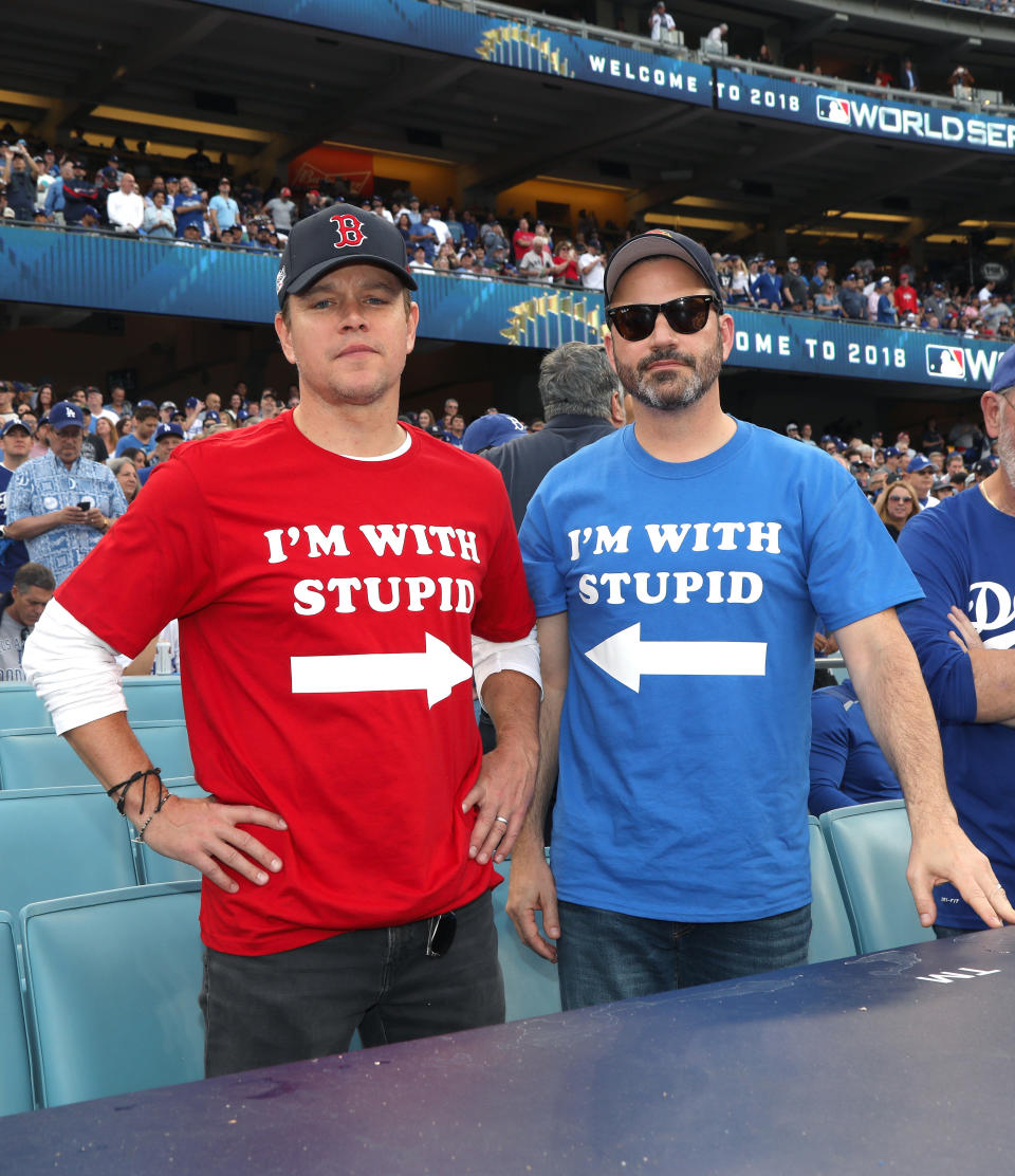 Matt Damon and Jimmy Kimmel watched the Boston Red Sox play the Los Angeles Dodgers in clashing attire Sunday. (Photo: Getty Editorial)