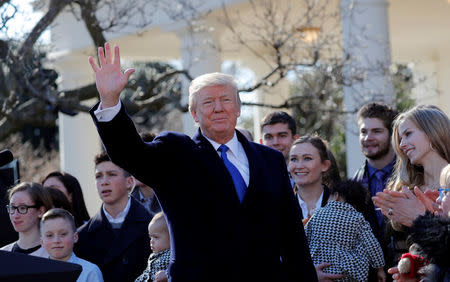 U.S. President Donald Trump waves after addressing the annual March for Life rally, taking place on the National Mall, from the White House Rose Garden in Washington, U.S., January 19, 2018. REUTERS/Carlos Barria