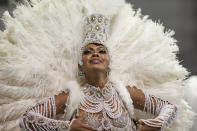 A dancer from the Academicos do Tucuruvi samba school performs during a carnival parade in Sao Paulo, Brazil, Friday, April 22, 2022. (AP Photo/Andre Penner)