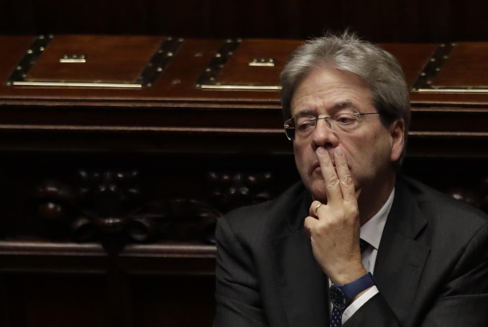 Italian Prime Minister Paolo Gentiloni sits in the parliament after giving his first speech as premier at the lower house where he will later face a confidence vote, in Rome Tuesday, Dec. 13, 2016. Paolo Gentiloni, a Democrat formerly serving as foreign minister, formed Italy’s new government Monday, keeping several key ministers from the coalition of Matteo Renzi, who resigned last week. (AP Photo/Alessandra Tarantino)