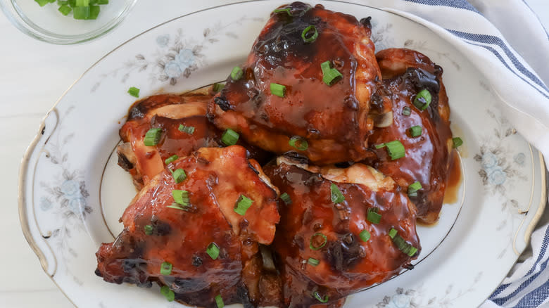 plate with glazed chicken thighs