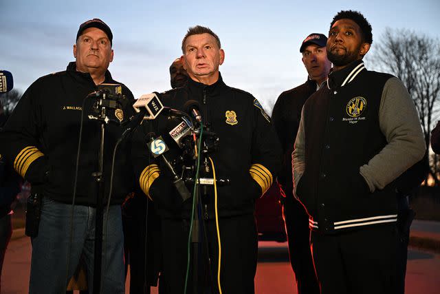 <p>JIM WATSON/AFP via Getty</p> Fire Department Chief James Wallace (L), Baltimore Police Commissioner Richard Worley (C) and Mayor Brandon Scott (R) speak at a press conference