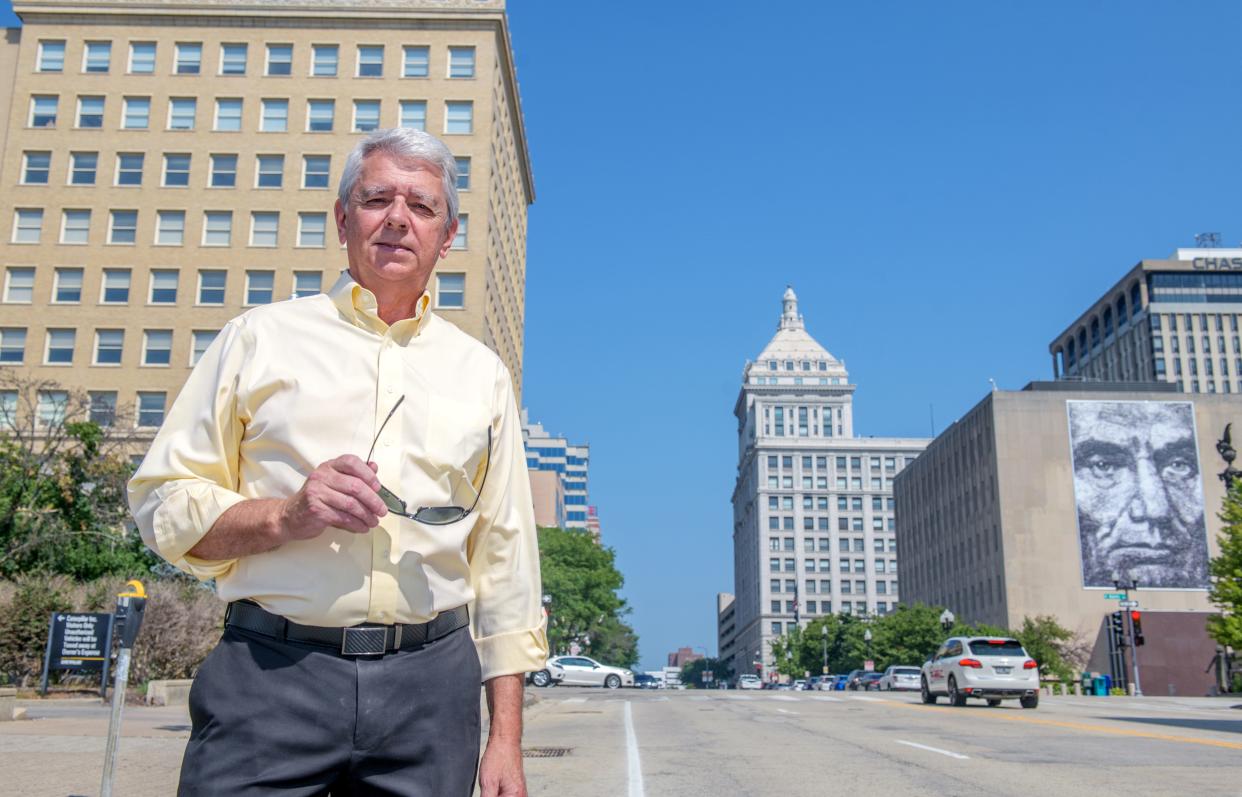 Developer Kert Huber owns the former Commerce Bank Building, middle, and the PNC Bank Building, left, as well as others in the Downtown Peoria area.