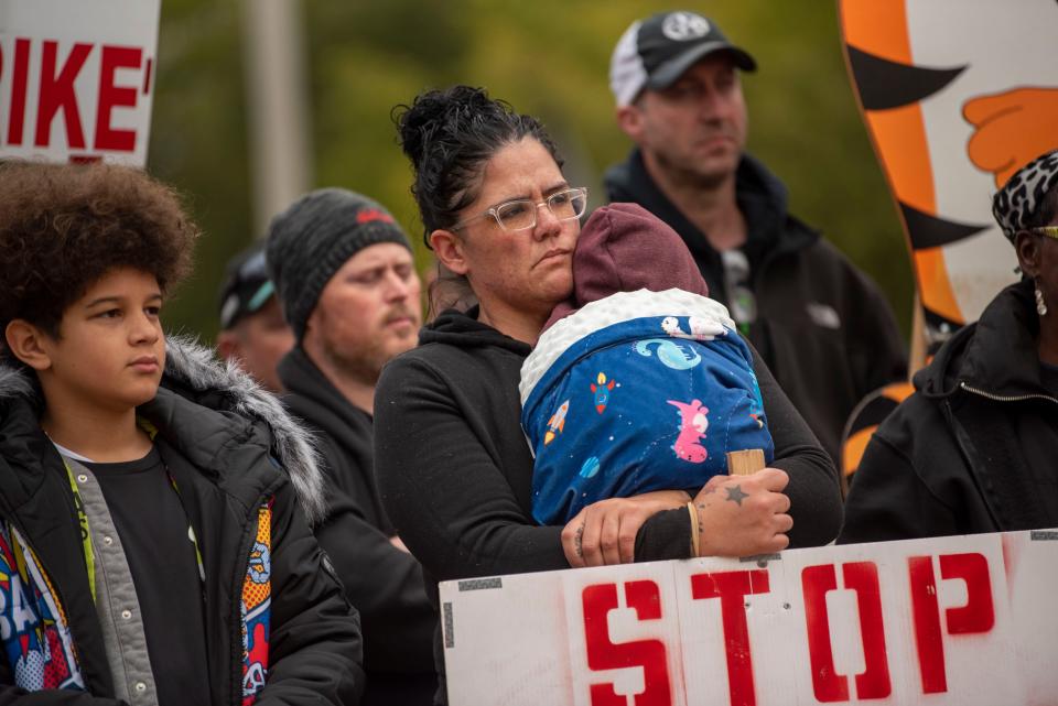 Brianna Artis holds 4-month-old Zyair Artis during a rally outside Kellogg's World Headquarters on Wednesday, Oct. 27, 2021, to support workers on strike in Battle Creek, Mich. (Alyssa Keown/Battle Creek Enquirer via AP) ORG XMIT: MIBAT304