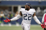 Tennessee Titans running back Derrick Henry reacts after his team beat the Seattle Seahawks 33-30 in overtime of an NFL football game, Sunday, Sept. 19, 2021, in Seattle. (AP Photo/Elaine Thompson)