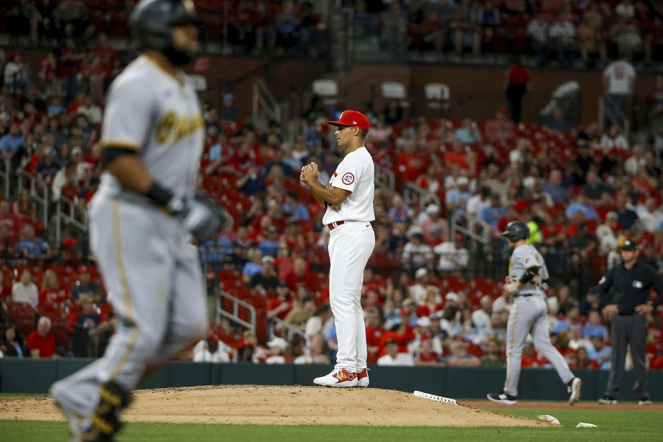 St. Louis Cardinals relief pitcher Jordan Hicks (12) pauses on the mound after walking Pittsburgh Pirates' Carlos Santana to load the bases during the seventh inning of a baseball game Thursday, April 13, 2023, in St. Louis. (AP Photo/Scott Kane)