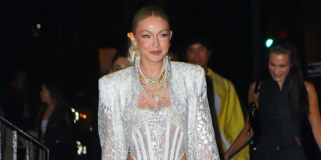 Gigi Hadid Wears Sheer Corseted Dress While Walking in Versace