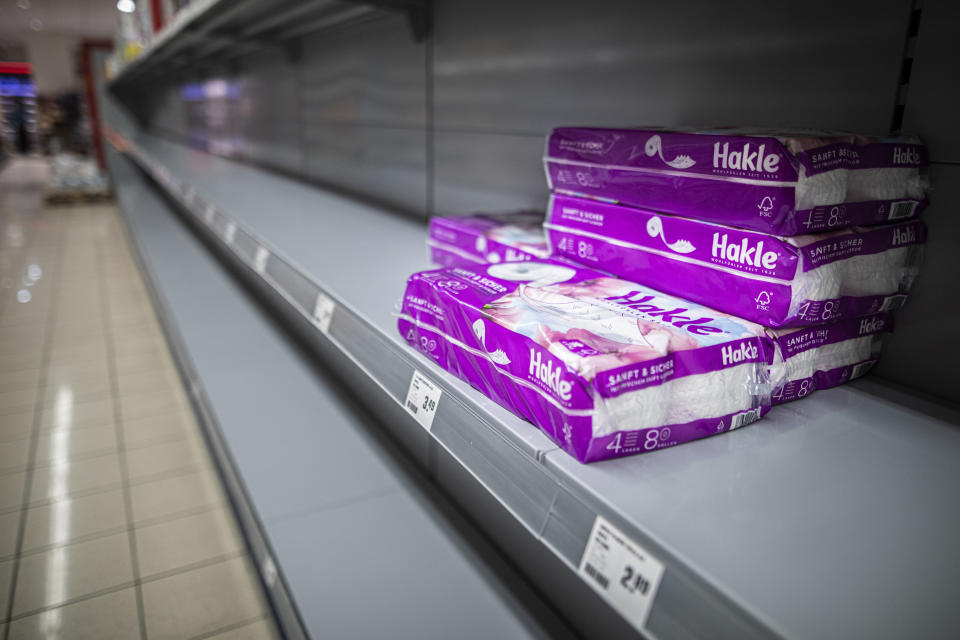 NIESKY, GERMANY - MARCH 13: Packages of toilet paper are pictured in an empty shelf in a supermarket on March 13, 2020 in Niesky, Germany. Many people are about to do panic buying because of the spread of corona virus. (Photo by Florian Gaertner/Photothek via Getty Images)