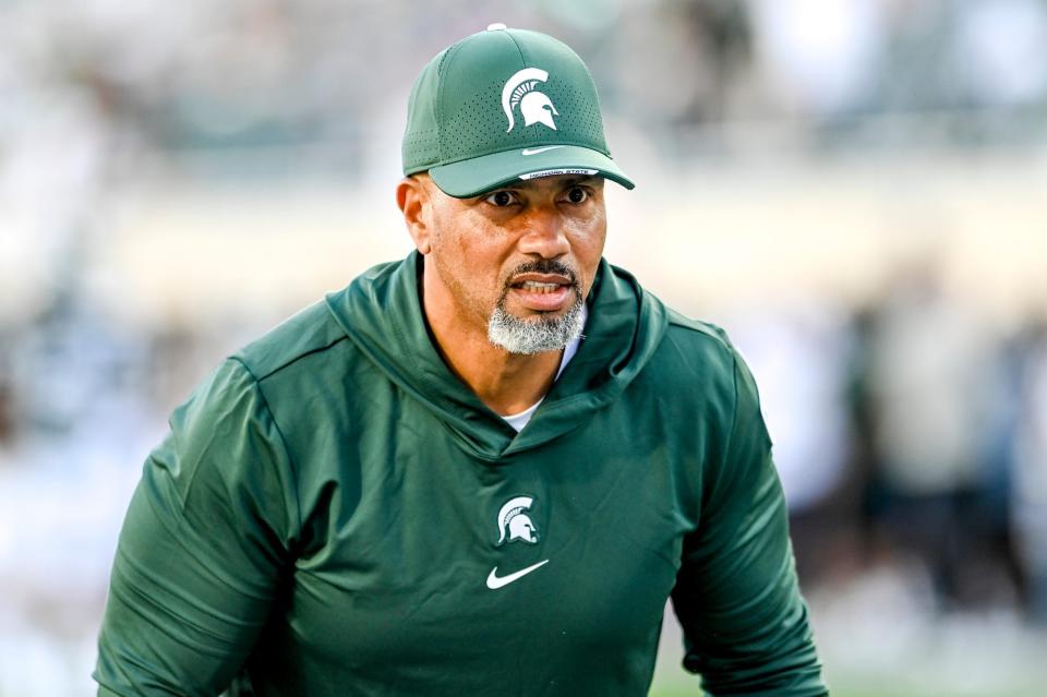 Michigan State's defensive line coach Diron Reynolds works with players before the football game against Central Michigan on Friday, Sept. 1, 2023, at Spartan Stadium in East Lansing.