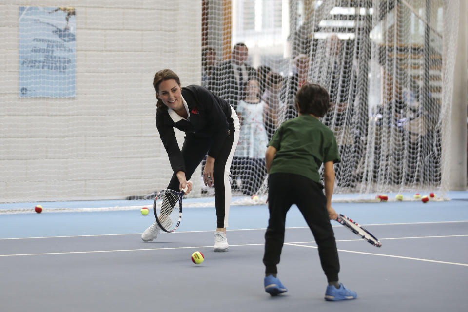 Despite being pregnant, Kate Middleton played some tennis with the U.K.’s top young talent. (Photo: PA)