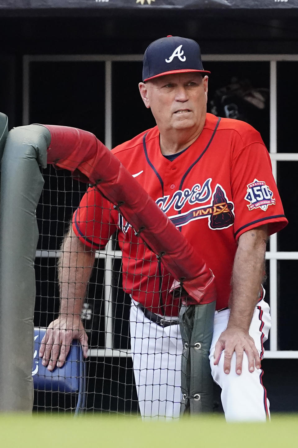 Atlanta Braves manager Brian Snitker watches from the dugout in the first inning of a baseball game against the Washington Nationals, Friday, Aug. 6, 2021, in Atlanta. (AP Photo/John Bazemore)