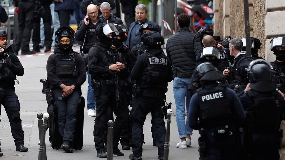 French police and members of French special police forces of Research and Intervention Brigade (BRI) secure the area near Iran consulate where a man is threatening to blow himself up