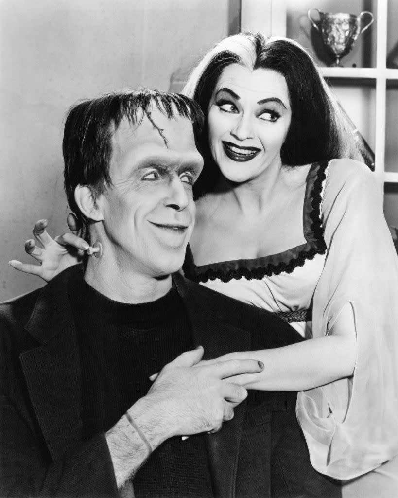 Gwynne as Herman Munster holding Lily's hand