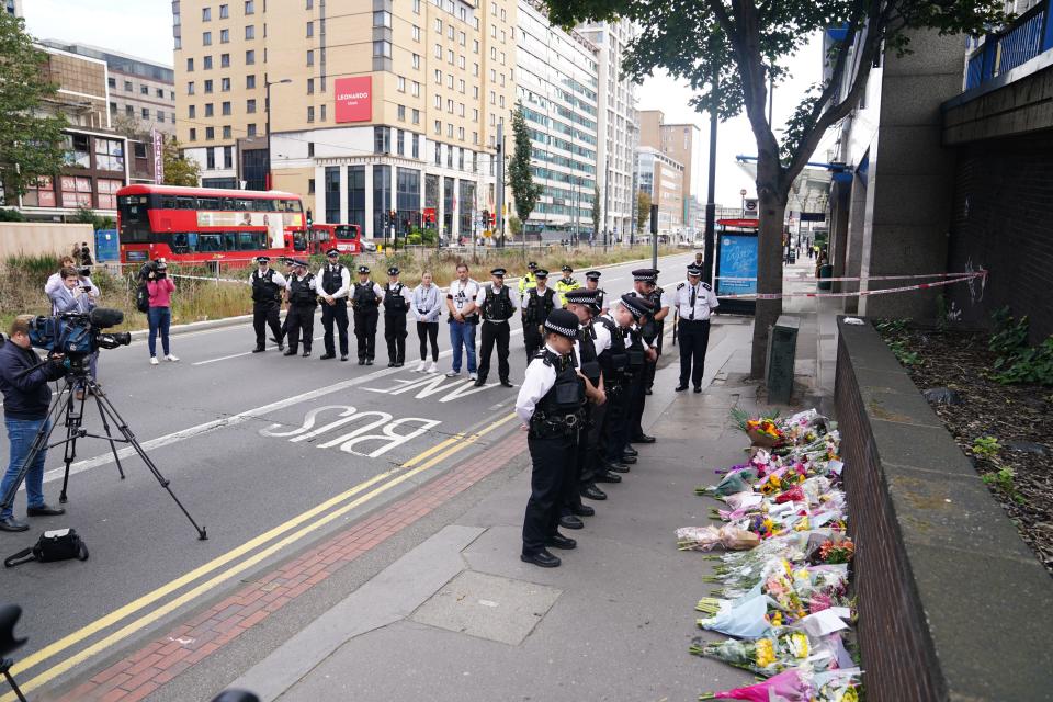 Police officers lay flowers at the scene in Croydon, south London, where 15-year-old Elianne Andam was stabbed to death on Wednesday morning. Picture date: Thursday September 28, 2023.