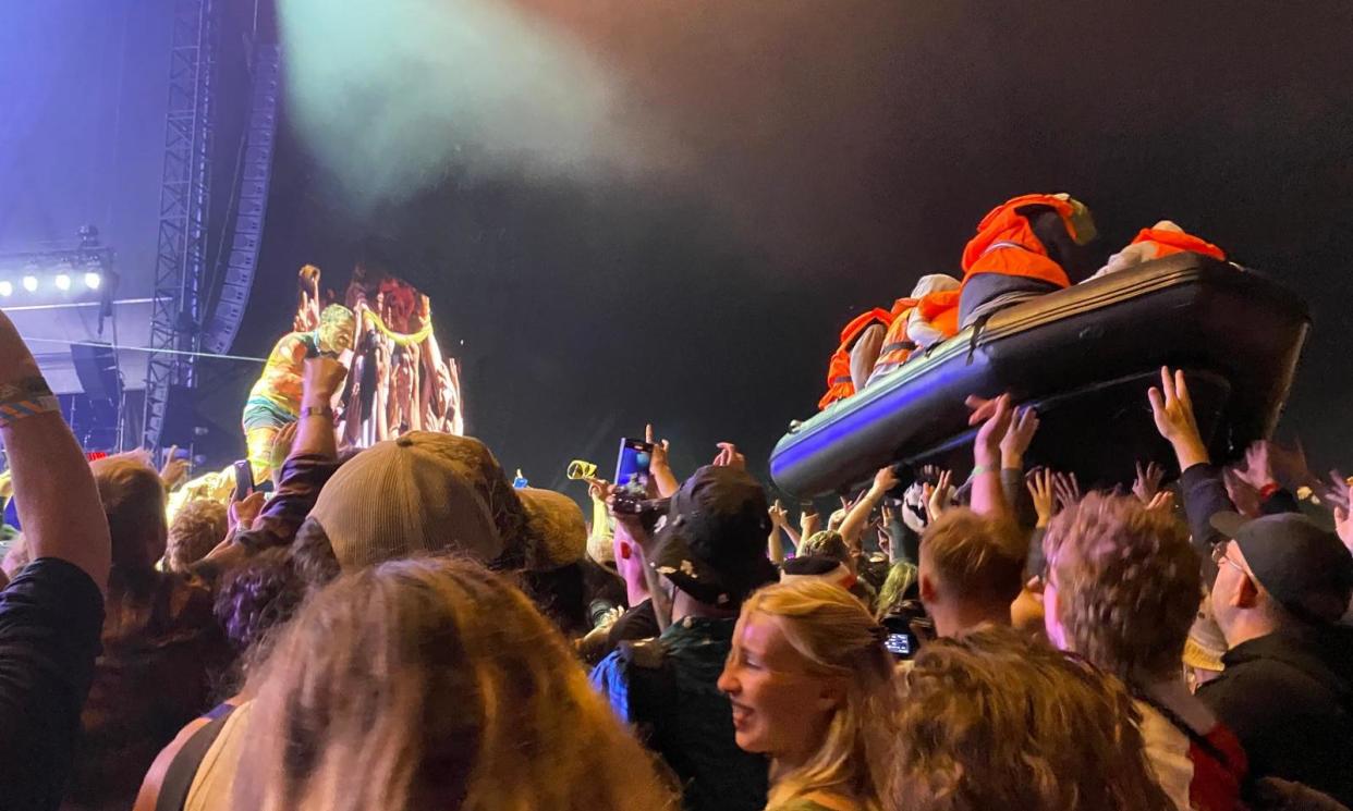 <span>The Banksy inflatable migrant boat artwork was released during Idles’ Glastonbury set.</span><span>Photograph: Safi Bugel/The Guardian</span>