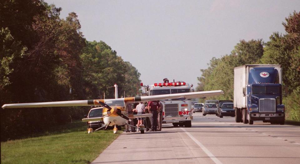 Southbound lane of Interstate 95 in New Smyrna Beach, Fla., is slowed to one lane as a single engine aiplane sits on the shoulder of the road, Friday, Nov. 20, 1998. The plane, piloted by Donald Kuhn, of Titusville, was forced down after running out of fuel.