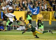 Seattle Seahawks wide receiver Doug Baldwin (89) catches a pass in the endzone for a touchdown against Green Bay Packers safety Micah Hyde (33) in the third quarter at Lambeau Field. Sep 20, 2015; Green Bay, WI, USA. Benny Sieu-USA TODAY Sports