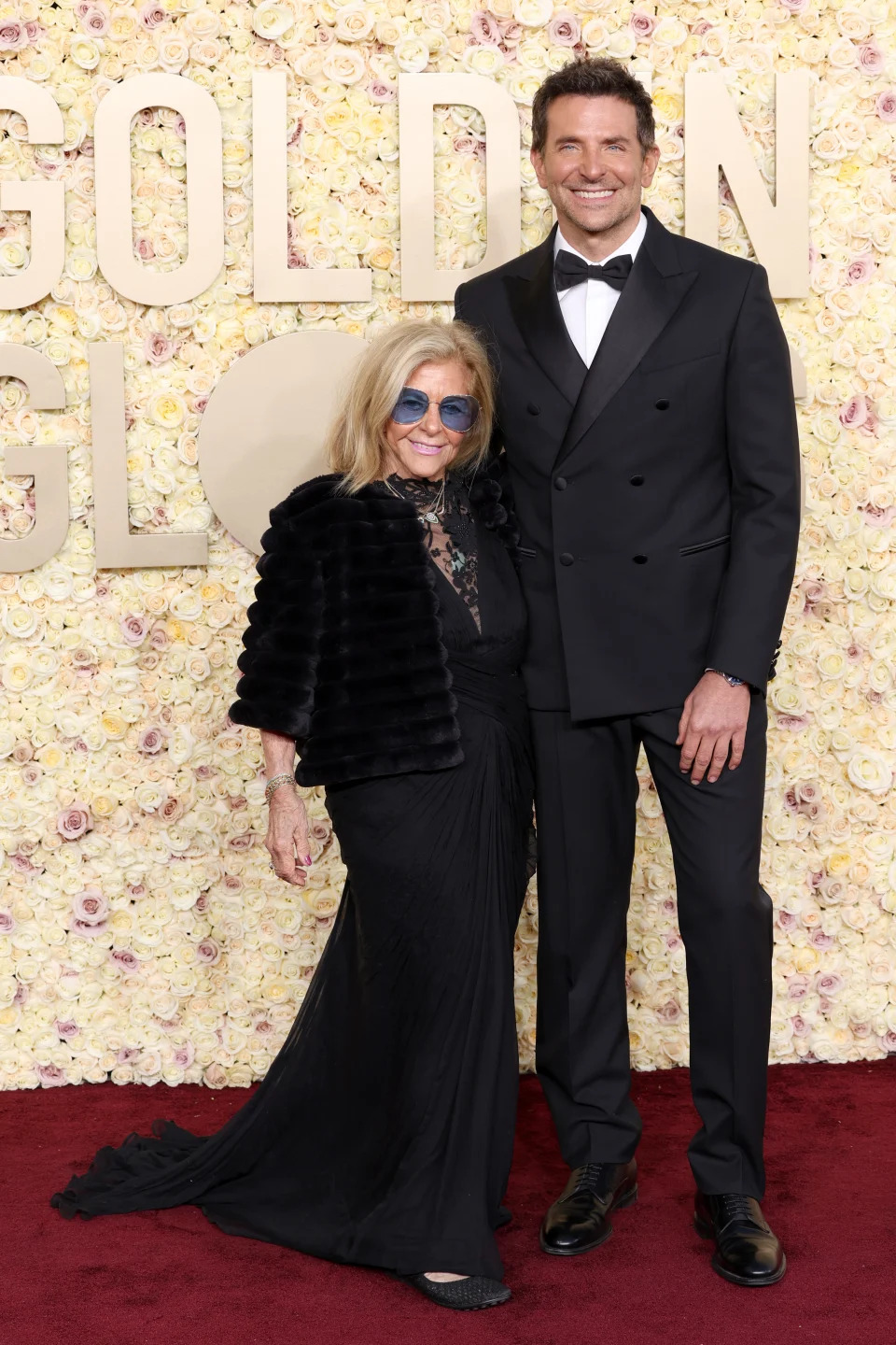 BEVERLY HILLS, CALIFORNIA - JANUARY 07: (L-R) Gloria Campano and Bradley Cooper attend the 81st Annual Golden Globe Awards at The Beverly Hilton on January 07, 2024 in Beverly Hills, California. (Photo by Kevin Mazur/Getty Images)