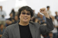 Director Bong Joon-ho poses for photographers at the photo call for the film 'Parasite' at the 72nd international film festival, Cannes, southern France, Wednesday, May 22, 2019. (AP Photo/Petros Giannakouris)