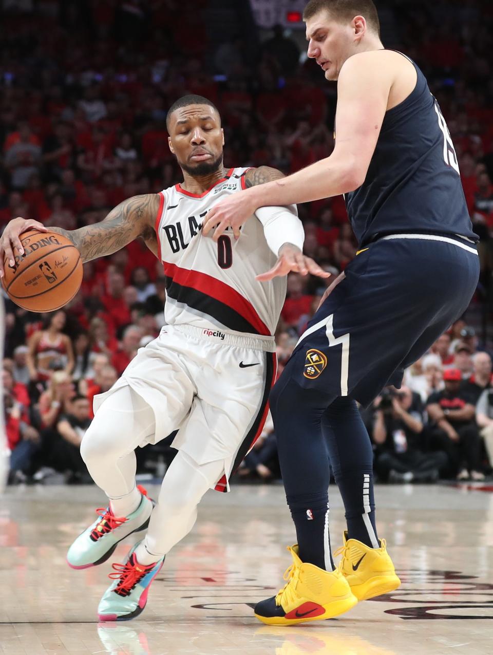 Trail Blazers guard Damian Lillard (0) and Nuggets center Nikola Jokic could be part of the NBA's 100th anniversary team.