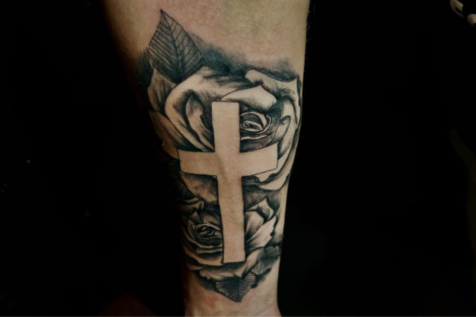 Forearm cross tattoo with roses <p>Micheal Backleh</p>