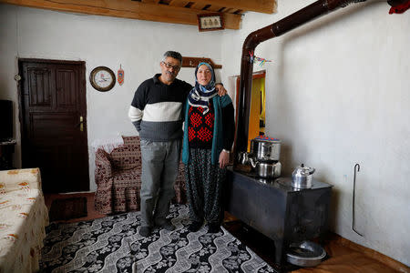 Zakir Omur, 58, and his wife Nurgul Omur, 53, pose at their home in Bogatepe village in Kars province, Turkey, February 8, 2018. Zakir is a farmer and Nurgul is a housewife. They have been married for 29 years and have two sons. "When I was young my mother wanted me to marry, I thought it was too early but traditions came first, then young people's will. They said there was a girl, Nurgul, that could be my wife. It was impossible to meet a girl anywhere else. So me and some of my relatives met Nurgul and her family at their home. We got engaged at our second meeting and after a short while we got married. When we were newly-wed, we started to live in this house with my mother and father. After a while my parents moved next door but we stayed here. During those years there wasn't a chance to date a girl. There wasn't a place to go. My mother didn't ask me if I loved Nurgul or not. She said, 'If you don't love her, keep in your mind: I like her!' But once we got married I got to know her better. I loved her. Now it's just the two of us living in our small home. We don't have any reason to get angry at each other. We all need someone to be together with in peace and have conversations. Life could be really difficult if we didn't love each other. The place we associate with our relationship, is our home. This is the place where we have lived since day one," said Zakir. REUTERS/Umit Bektas