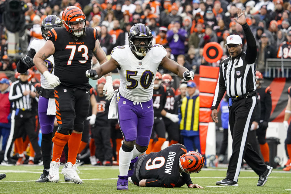 Baltimore Ravens linebacker Justin Houston (50) celebrates a sacks of Cincinnati Bengals quarterback Joe Burrow (9) in the second half of an NFL football game in Cincinnati, Sunday, Jan. 8, 2023. (AP Photo/Joshua A. Bickel)