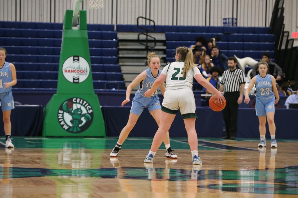 York's Nya Avery defends Spruce Mountain's Jaydn Pingree in Saturday's Class B South quarterfinal at the Portland Expo.