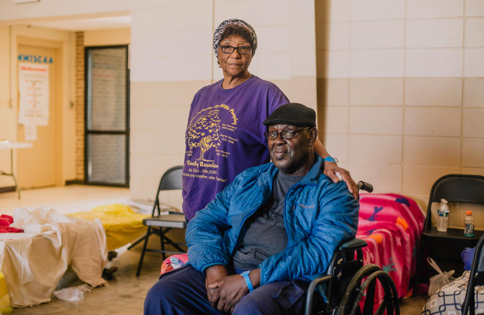 Mae Smith and Will Smith rest as they wait for family to arrive at the Red Cross shelter in Rolling Fork, Miss., on March 26, 2023. (Imani Khayyam for NBC News)