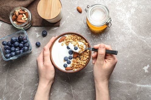 <span class="caption">Our health is affected by the combination of nutrients foods contain.</span> <span class="attribution"><a class="link " href="https://www.shutterstock.com/image-photo/woman-eating-tasty-yogurt-berries-granola-1093191254" rel="nofollow noopener" target="_blank" data-ylk="slk:New Africa/ Shutterstock;elm:context_link;itc:0;sec:content-canvas">New Africa/ Shutterstock</a></span>