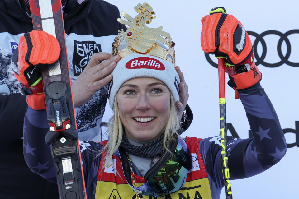 FILE - A crown is placed on United States' Mikaela Shiffrin's head after she won an alpine ski, women's World Cup giant slalom, her 84th World Cup race, in Kronplatz, Italy, Wednesday, Jan. 25, 2023. Shiffrin isn't putting the same pressure on herself for the upcoming world championships, starting on on Feb. 6, 2023 in Courchevel and Meribel, France, that she did for last year's Beijing Olympics. The event is Shiffrin's first major championship since American skier didn't win a medal and didn't finish three of her five races at the Olympics. (AP Photo/Alessandro Trovati, File)