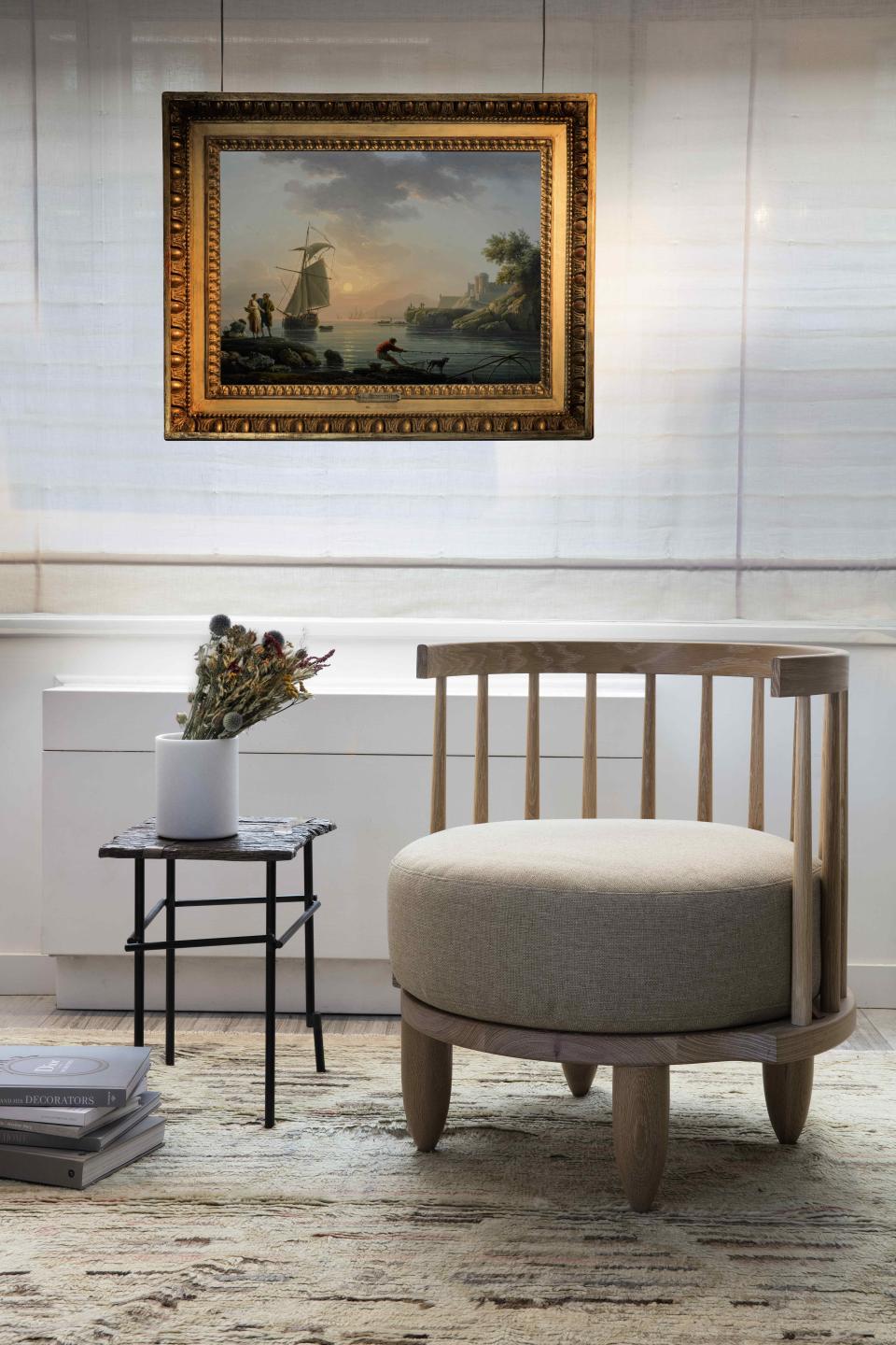 A Michael Robbins chair and Chuck Moffit table complement Claude-Joseph Vernet's A Mediterranean Port at Sunset.