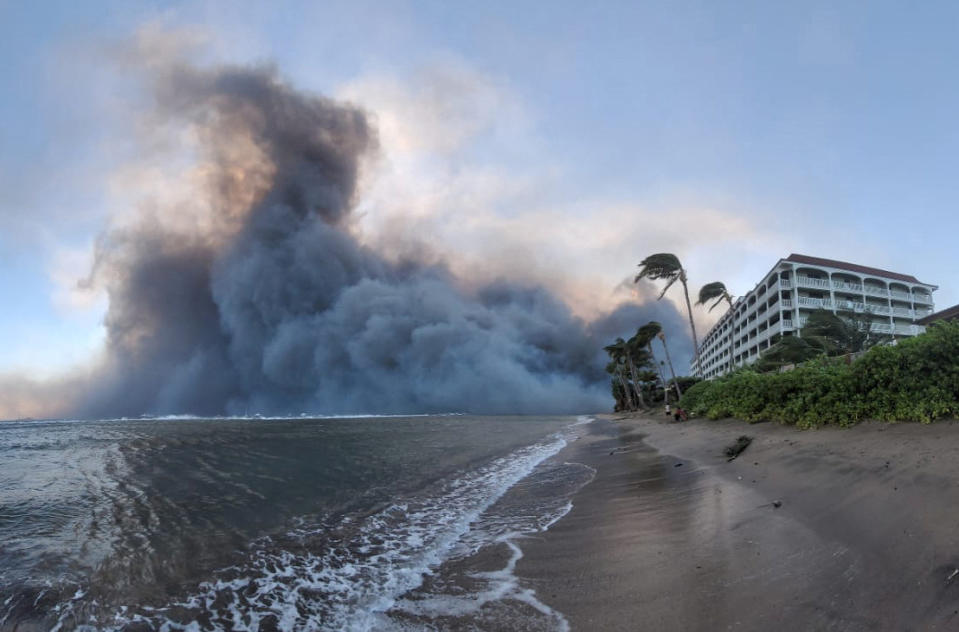 Smoke billows near Lahaina as wildfires driven by high winds destroy a large part of the historic town of Lahaina, in Kahului, Hawaii, U.S. August 9, 2023. Dustin Johnson/Handout via REUTERS  THIS IMAGE HAS BEEN SUPPLIED BY A THIRD PARTY.