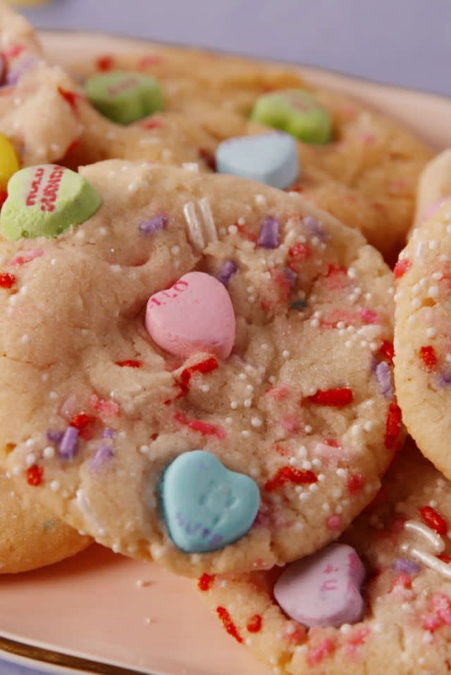 <p>The iconic Valentine's candy isn't just for kids to have and enjoy at school — it makes for a pretty sweet cookie decoration, too.</p><p><em>Get the recipe at <a href="https://www.delish.com/cooking/recipe-ideas/recipes/a57796/conversation-heart-cookies-recipe/" rel="nofollow noopener" target="_blank" data-ylk="slk:Delish;elm:context_link;itc:0;sec:content-canvas" class="link ">Delish</a>.</em> </p>