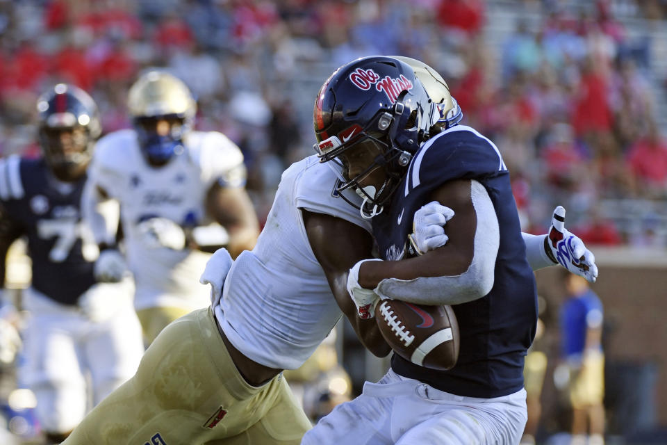 Tulsa safety Kendarin Ray (1) forces a fumble from Mississippi running back Quinshon Judkins (4) during the second half of an NCAA college football game in Oxford, Miss., Saturday, Sept. 24, 2022. Mississippi won 35-27. (AP Photo/Thomas Graning)