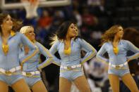 UCLA cheerleaders perform against the Florida during the first half in a regional semifinal game at the NCAA college basketball tournament, Thursday, March 27, 2014, in Memphis, Tenn. (AP Photo/John Bazemore)